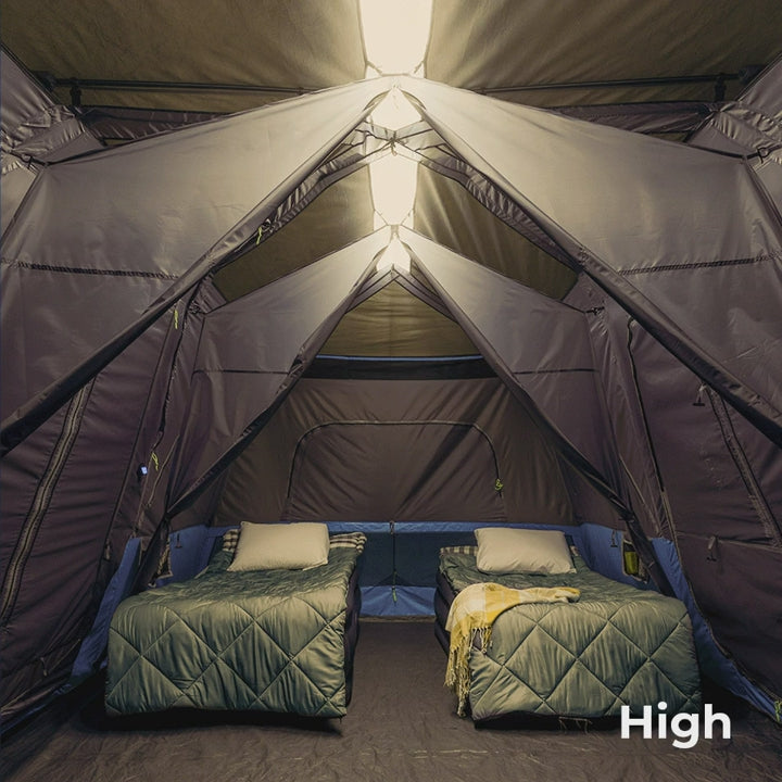 A large, brown CORE 12-person instant cabin tent measuring 18 feet by 10 feet. The tent features built-in LED lights for added convenience and safety, and it has a spacious interior, multiple windows, and a sturdy frame for easy setup.