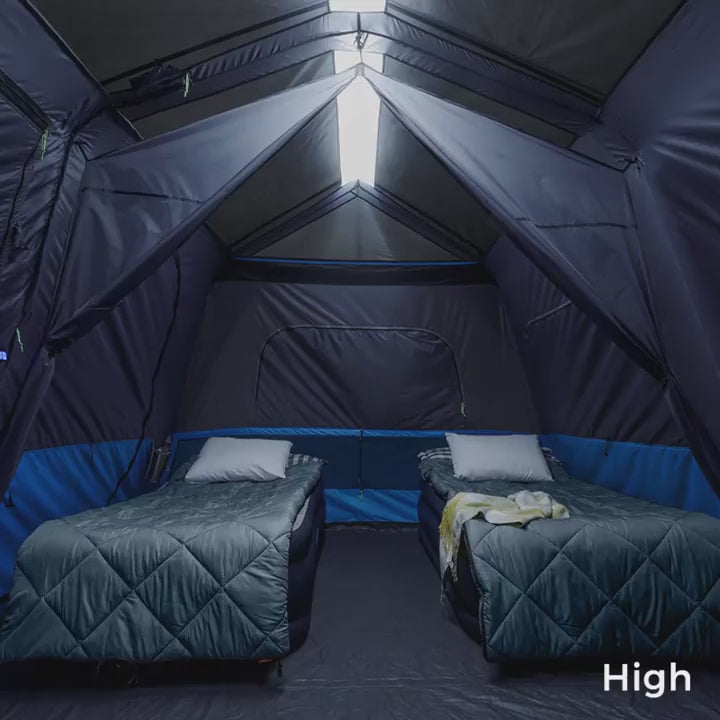 A large, orange and gray CORE 10-person instant tent with a lighted screen room. The tent has a spacious interior and multiple windows, providing ample ventilation and natural light.