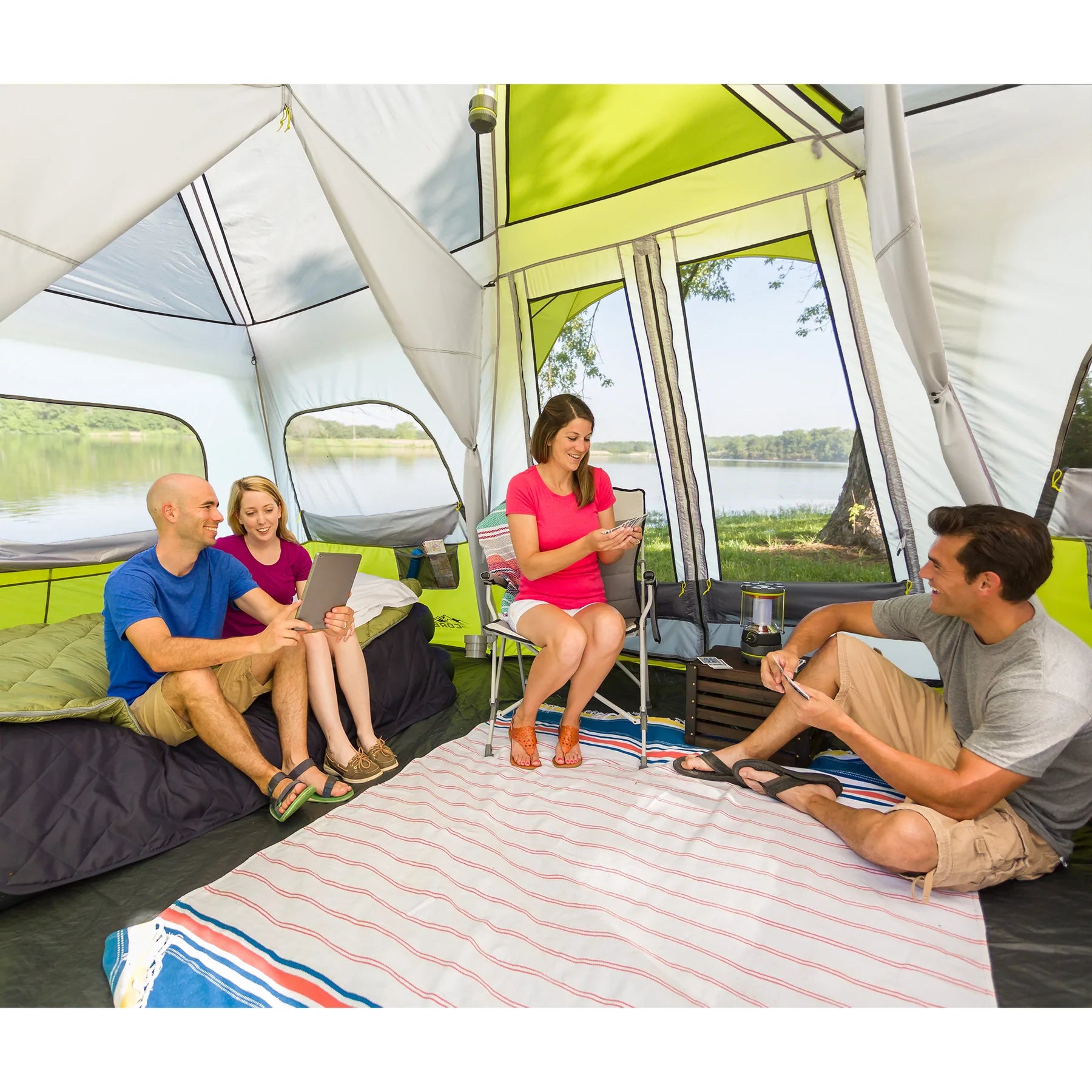 A large, brown CORE 12-person instant cabin tent measuring 18 feet by 10 feet. The tent has a spacious interior, multiple windows, and a sturdy frame for easy setup