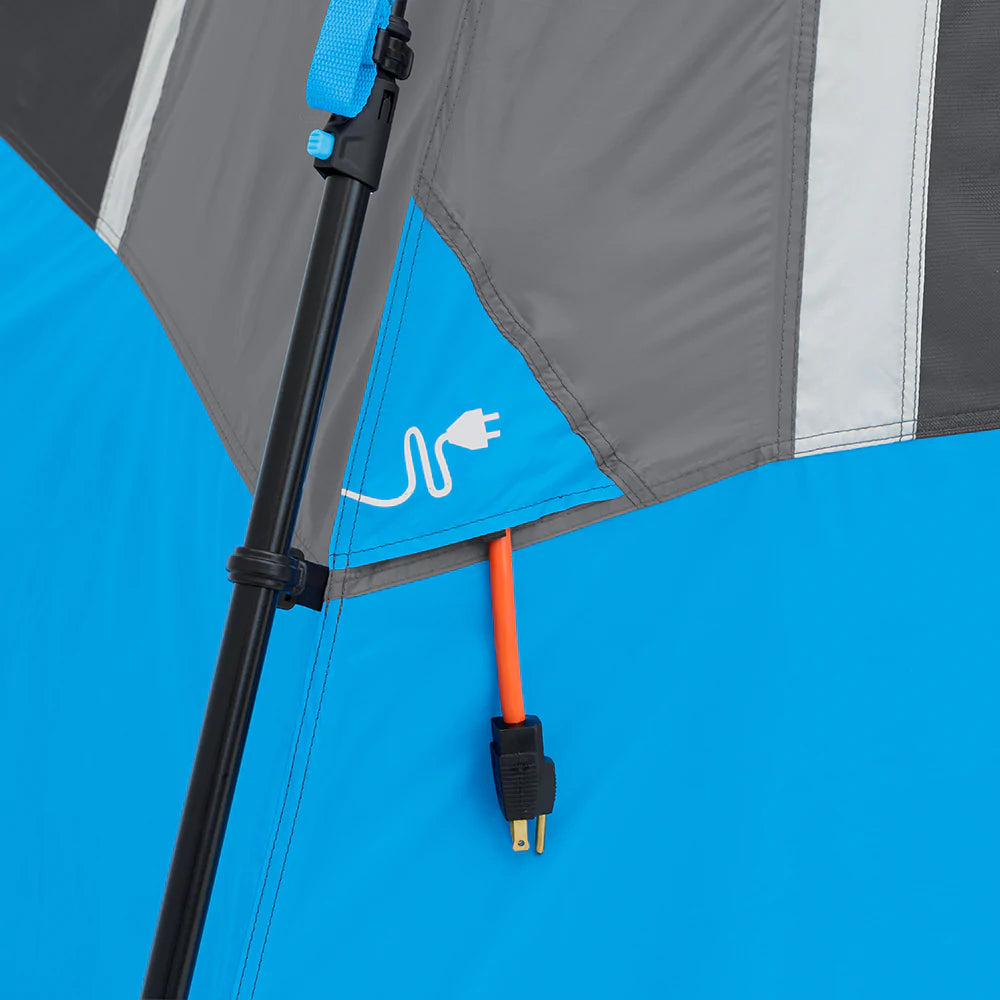 A large, brown CORE 12-person instant cabin tent measuring 18 feet by 10 feet. The tent features built-in LED lights for added convenience and safety, and it has a spacious interior, multiple windows, and a sturdy frame for easy setup.