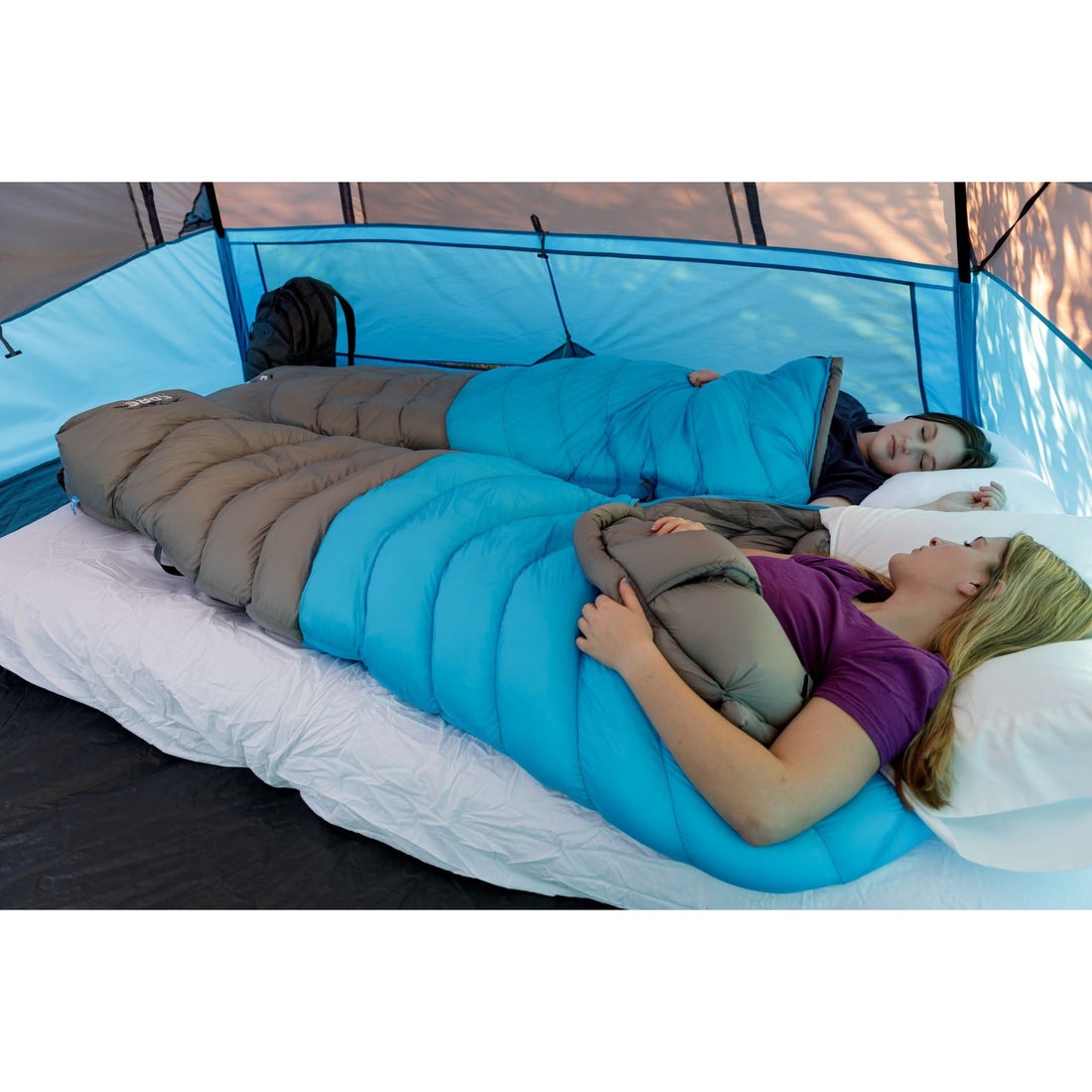 A blue and gray CORE 10-degree mummy sleeping bag. The sleeping bag is designed for cold weather camping and features a mummy shape for warmth and insulation.