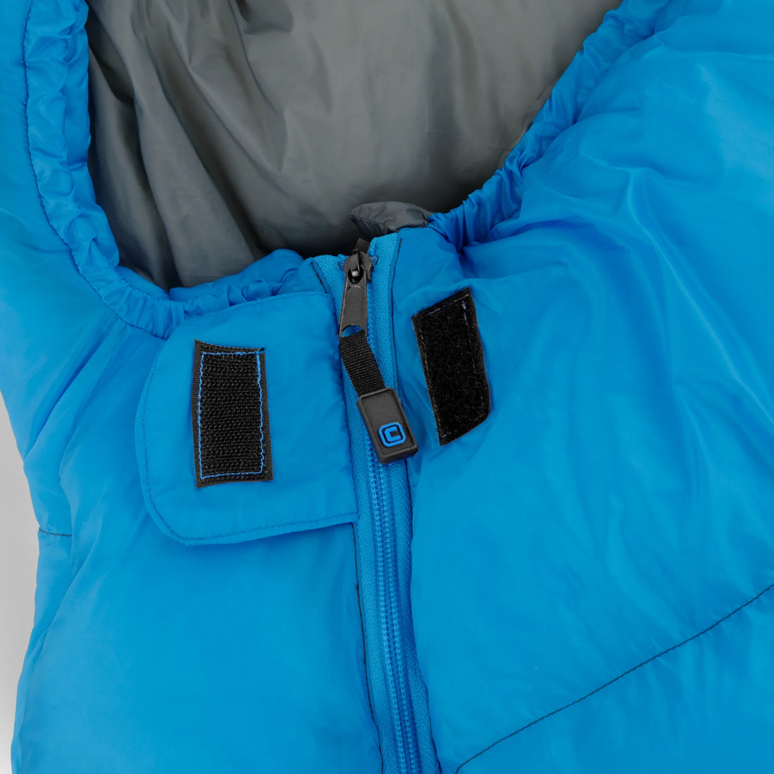 A blue and gray CORE 10-degree mummy sleeping bag. The sleeping bag is designed for cold weather camping and features a mummy shape for warmth and insulation.