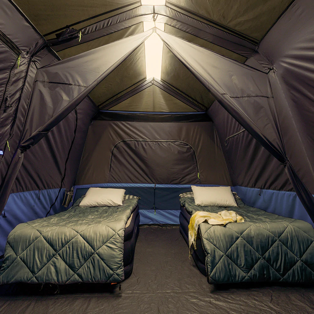A large, orange and gray CORE 10-person instant tent with a lighted screen room. The tent has a spacious interior and multiple windows, providing ample ventilation and natural light.