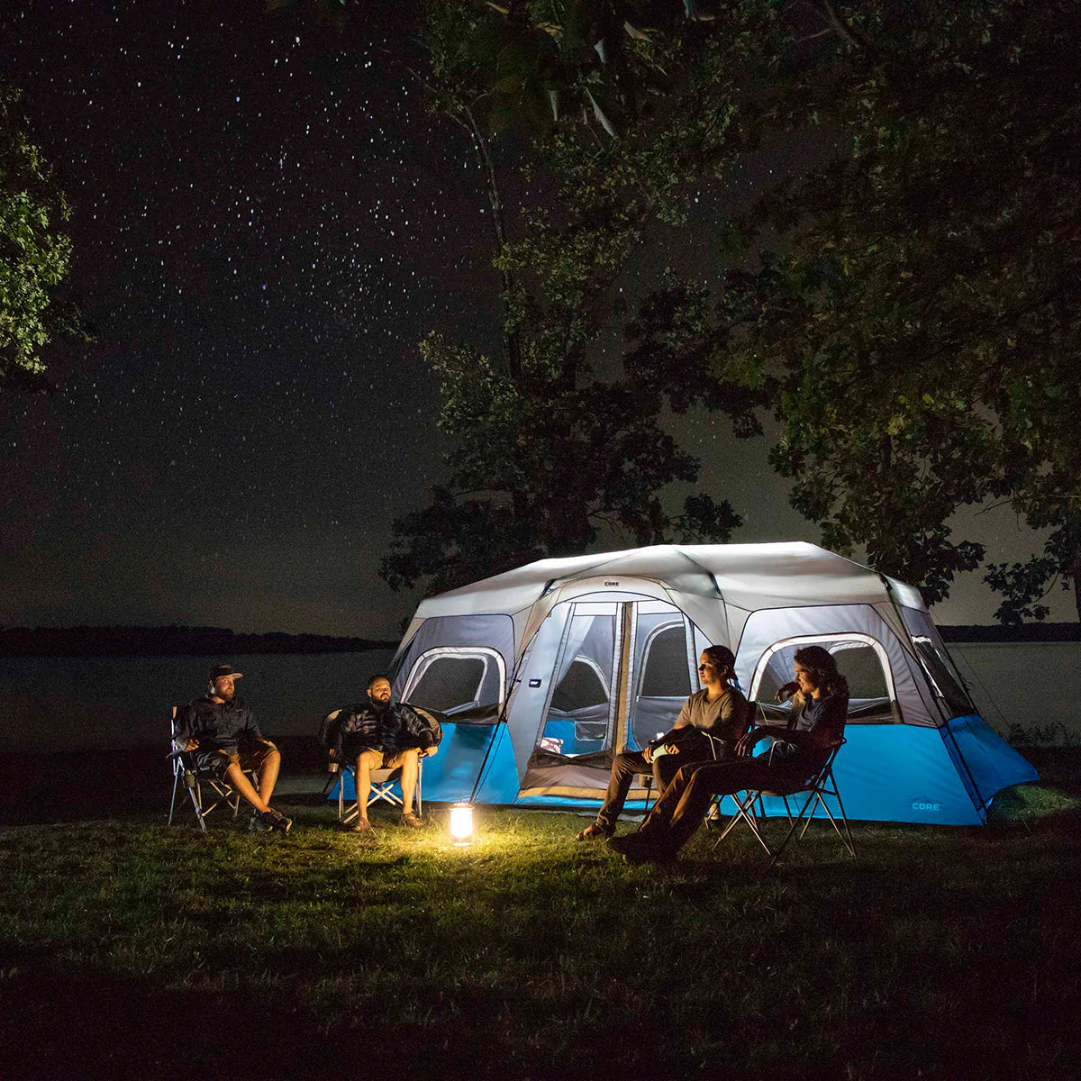 A large, brown CORE 12-person instant cabin tent measuring 18 feet by 10 feet. The tent features built-in LED lights for added convenience and safety, and it has a spacious interior, multiple windows, and a sturdy frame for easy setup.